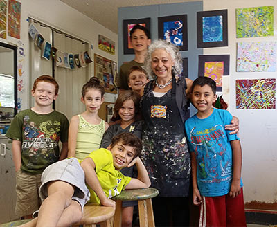 School-age children with one adult in group portrait of Linda Ahearn and her children art students at Toscana Studio